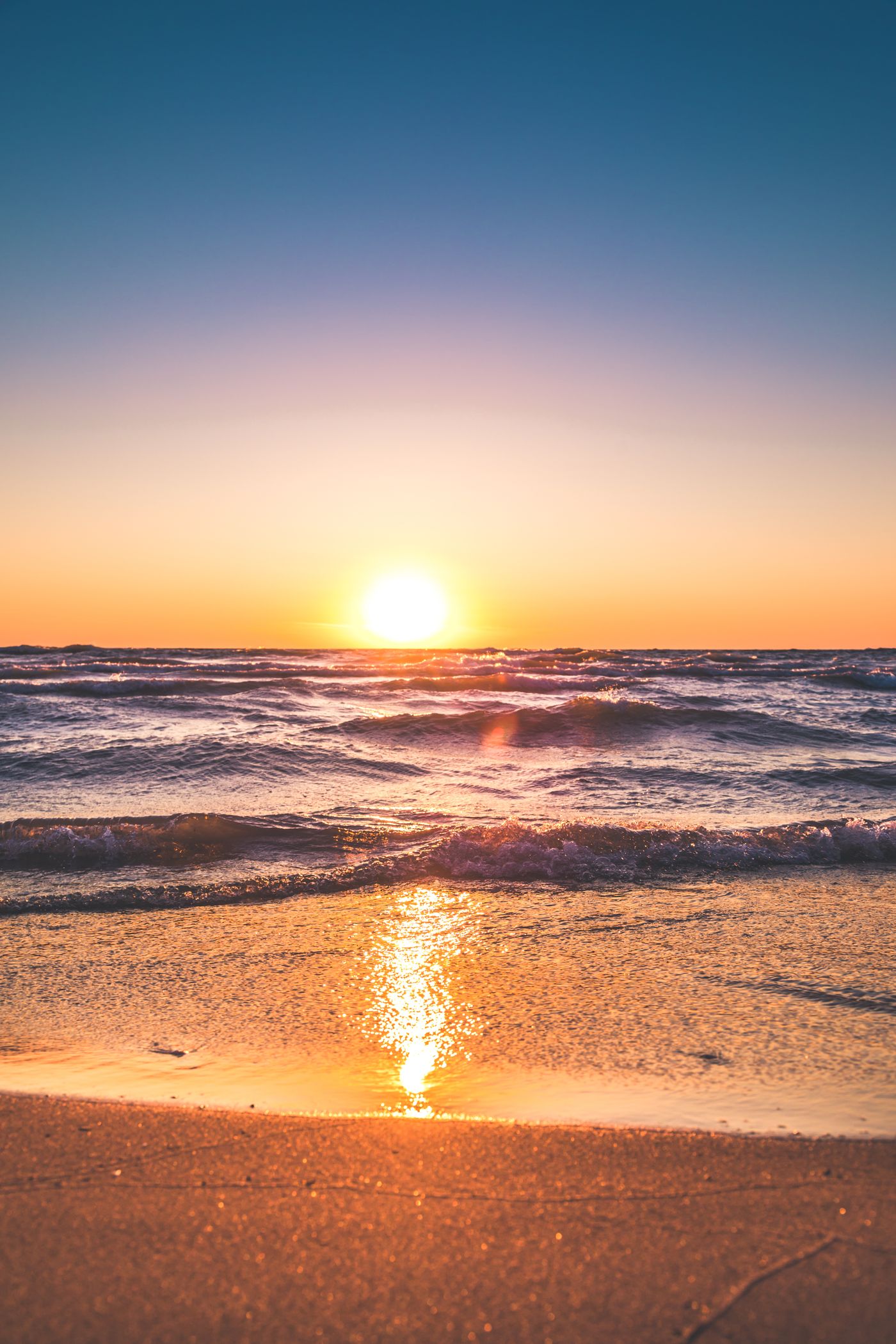 Sunrise over a calm coastline